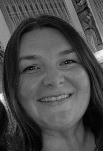 Smiling woman with long hair, promoting personalized travel experiences and family vacations with Once Upon A Trip Travel.